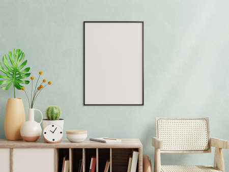 Poster mockup with vertical frame on empty dark blue wall in living room interior.3d renderingの写真素材