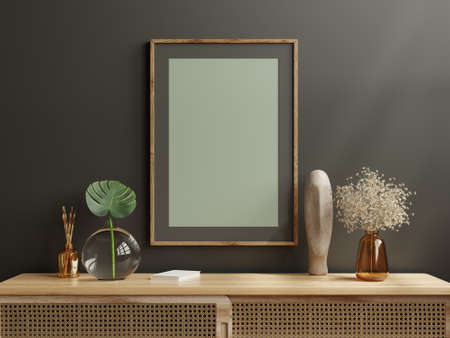 Dark photo frame on cabinet in living room interior on empty dark wall.3D renderingの写真素材