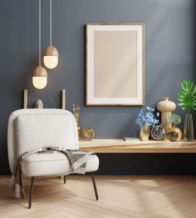Mock up poster frame in modern interior with armchair on dark blue wall background.3d renderingの写真素材