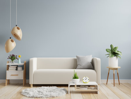 Light blue wall mock up in warm tones with cream color sofa and decoration minimal.3d renderingの写真素材