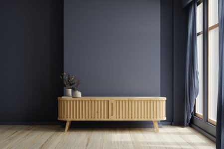 Modern living room decor with a tv cabinet and dark blue wall background.3d renderingの写真素材
