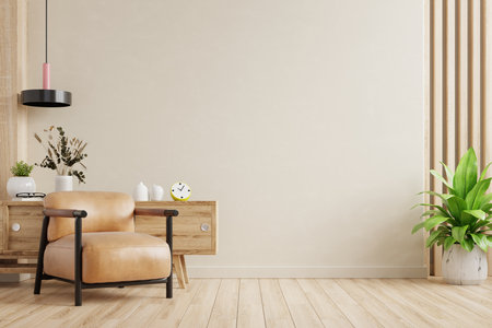 Cream room wall mock up in warm tones with leather armchair and decoration minimal.3d renderingの写真素材