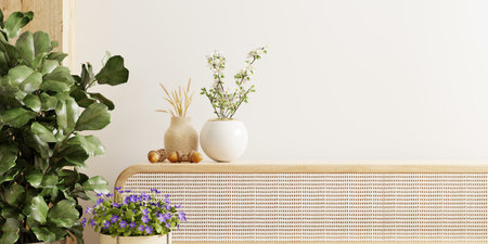 Wall mockup featuring a vase and a vibrant green plant, set against a backdrop of white walls and cabinet.3d renderingの写真素材