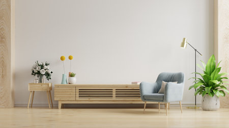 Empty living room mockup a TV wall mounted with blue armchair in living room with white wall.3d renderingの写真素材