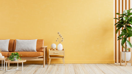 Living room wall mockup with leather sofa and decor on yellow wall background- 3D renderingの写真素材
