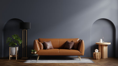 Mockup dark blue wall of living room with leather sofa on wood flooring- 3D renderingの写真素材