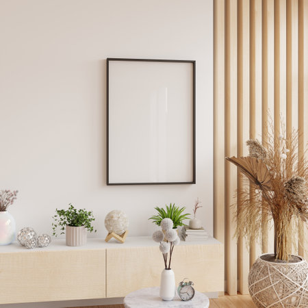Mockup frame poster hanging on a minimalist wall above a wooden cabinet adorned with potted plants and decorative items- 3D renderingの写真素材