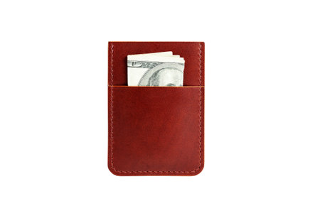 Isolated leather card holder with cash on a white background.の写真素材