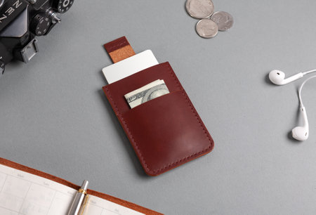 Leather cardholder with dollars and cards on the diary.の写真素材