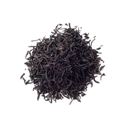 A bunch of chinese black tea, isolated on a white background, close up. Smoked Chinese Black Tea use for weight loss, caffeine alternative and improving heart health.の写真素材
