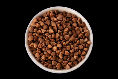 Buckwheat groats on a black background. macro. close-upの写真素材