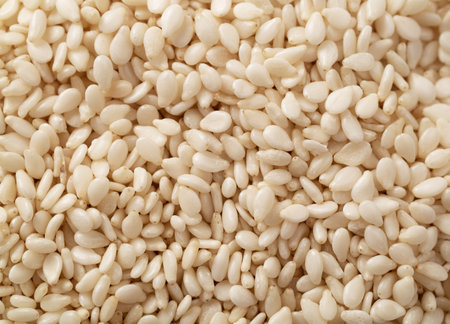 Pile of white sesame seeds as background, top view. Macro. Extreme close up.の写真素材