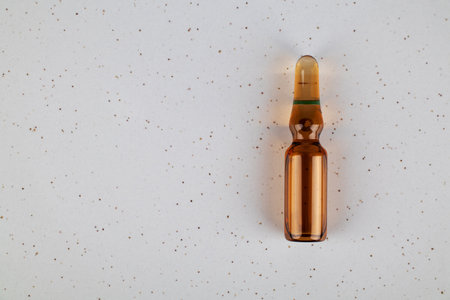 Medical ampoule on a ceramic background. Medicine conceptの写真素材
