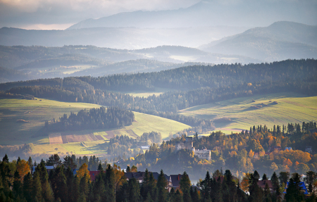 Poland autumn hills. Sunny October day in Malopolska mountain village. Fall in Polandの写真素材
