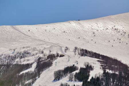 Ski elevator on winter sunny day. Beautiful alps winter panoramic aerial viewの写真素材