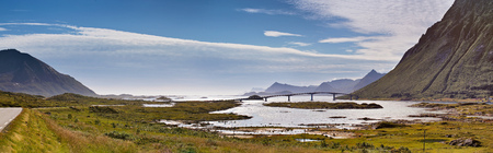 Fantastic bridge through fjord on Lofoten islands in Norway. Travel background. Sunny summer landscape panoramaの写真素材