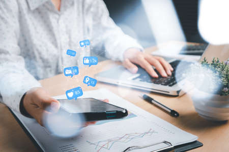 Woman using smart phone on office desk with copy space, Social, media, Marketing concept.の写真素材