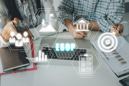 Esop - Employee Stock Ownership Plan concept, Business adviser meeting to analyze and discuss the situation on the financial report with esop icon on virtual screen.の写真素材