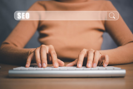 SEO Concept, Search Engine Optimization, Woman hand typing keyboard with VR screen seo icon, concept for promoting ranking traffic on website, optimizing your website to rank in search engines.の写真素材