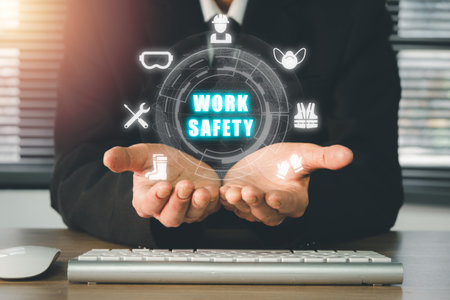 Work safety concept, Person hand holding holographic VR screen work safety icon, First secure rules. Health protection, personal security people on job.の写真素材