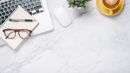 Flat lay, White office desk with laptop computer, notebook, eyeglass, pen, mouse and coffee, Top...
