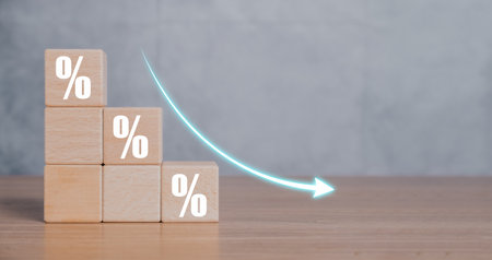 Cost reduction business finance concept, Wooden cube block with down arrows, Depreciation of national currency, inflation, investment attractiveness. Economic decline fall difficulties.の写真素材