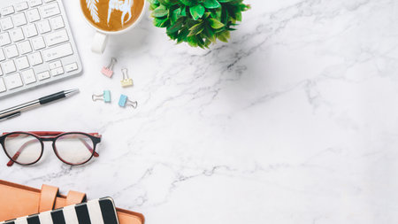 Top view, White Office desk with keyboard computer, pen, eyeglass, mouse and notebook, copy space, Mock up.の写真素材