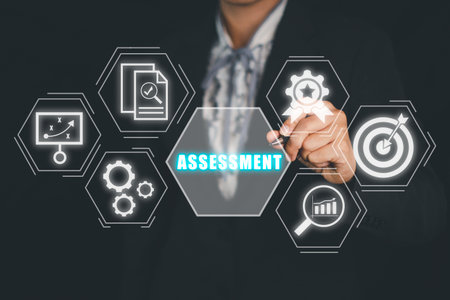 Assessment analysis Business analytics evaluation measure technology concept, Business person hand touching assessment icon on virtual screen.の写真素材
