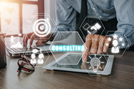Consulting business concept, Businessman using digital tablet on office desk with consulting icon on virtual screen, Investment Consultant,Financial Consultant.の写真素材