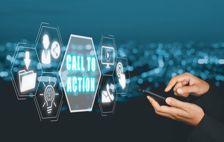 Call To Action concept, Person hand using smart phone with call to action icon on virtual screen.の写真素材