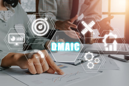 DMAIC is an acronym for Define, Measure, Analyze, Improve and Control concept, Business team analyzing financial data on office desk with DMAIC icon on virtual screen.の写真素材