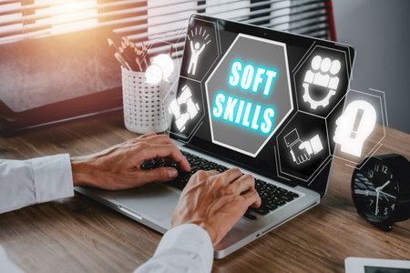 Soft skills training and improvement concept, Businessman working on laptop computer with Soft skills icon on office desk workplace background.の写真素材