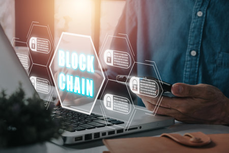 Blockchain technology concept, Person working on laptop computer with blockchain icon on vr screen, Fintech concept with encrypted ledger blocks chained.の写真素材