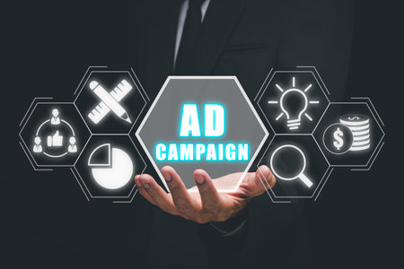 Ad Campaign concept, Business person hand holding ad campaign icon on virtual screen.の写真素材