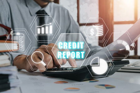 Credit report concept, Businessman using calculator and analyzing business charts on office desk with credit report icon on virtual screen,.の写真素材