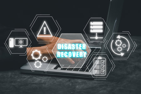 Disaster Recovery concept, Person hand using laptop computer with Disaster Recovery icon on virtual screen.の写真素材
