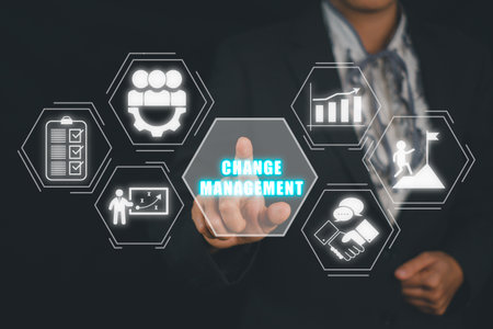 Change management in organization and business concept, Business person hand pointing change management icon on virtual screen, plan, implementation, communication, team, success.の写真素材