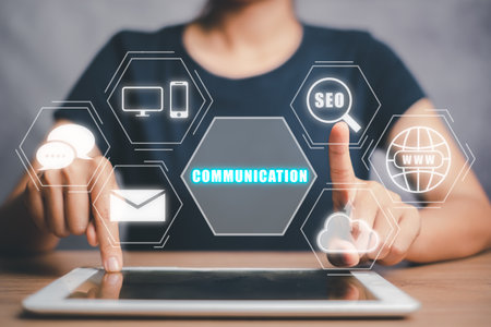 Communication concept, Person working on digital tablet with communication icon on virtual screen.の写真素材