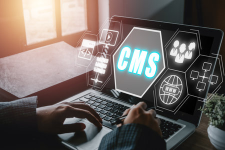 CMS, Content management system concept, Person hand using laptop computer with Content management system icon on virtual screen background, business web computer website administration.の写真素材