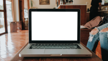 Blank screen laptop computer set up for work on white wooden desk, Mockup, Empty screen, Blank screen for product display.の写真素材