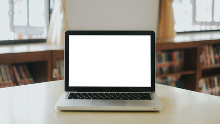 Blank screen laptop computer set up for work on white wooden desk, Mockup, Empty screen, Blank screen for product display.の写真素材