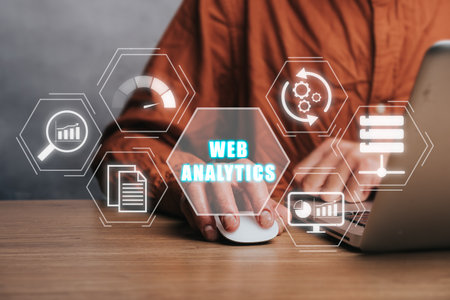 Web analytics concept, Person working on laptop computer with web analytics icon on virtual screen.の写真素材