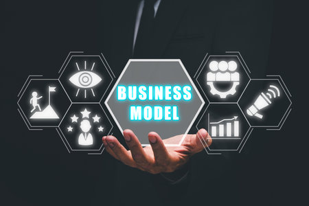 Business model and planning project concepts, Businessman hand holding business model icon on virtual screen.の写真素材
