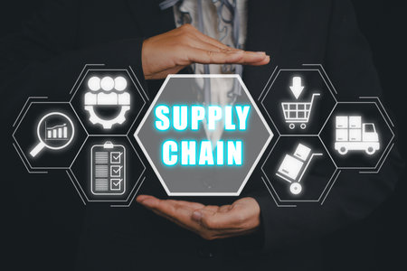 Supply chain management concept, Business person hand holding supply chain icon on virtual screen.の写真素材