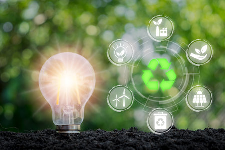 ESG concept of environmental, Light bulb on soil with ESG icon on virtual screen, social and corporate governance concept.の写真素材