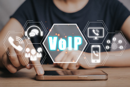 VoIP, Voice over IP Telecommunication concept, Business person hand using smartphone with VoIP icon on virtual screen.の写真素材