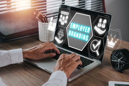 Employer branding concept, Busienssman working on laptop computer with employer branding icon on virtual screen.の写真素材