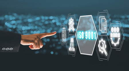 ISO 9001 concept, Business person hand touching iso 9001 icon on virtual screen with blue bokeh background.の写真素材