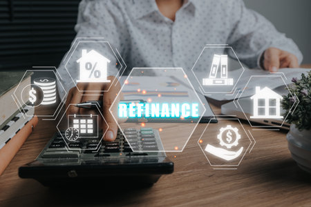 Refinance concept, Businesswoman using calculator on office desk with refinance icon on virtual screen.の写真素材
