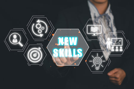 New skills concept, Business person hand touching new skills icon on virtual screen.の写真素材